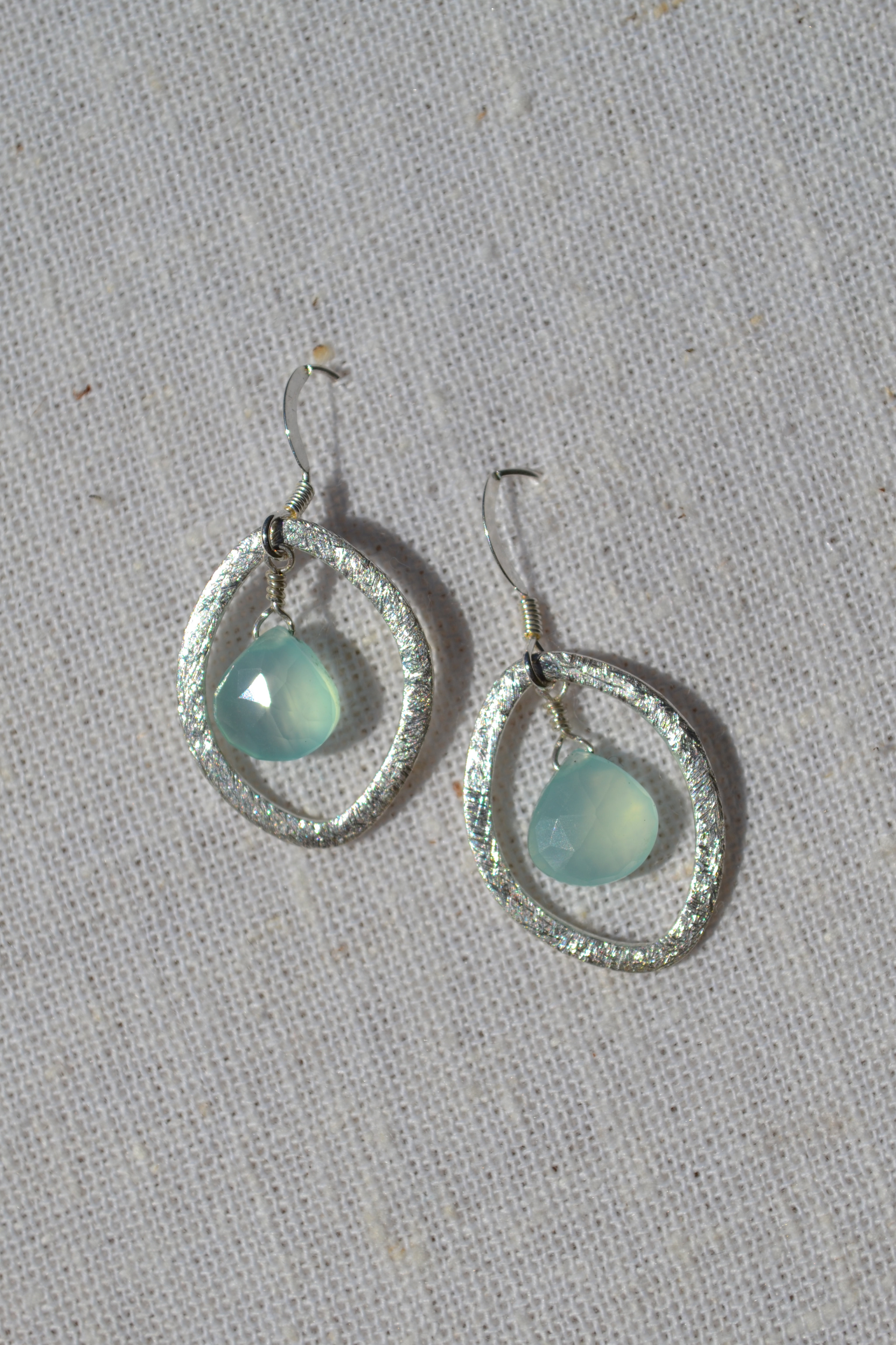 Silver brush oval earrings with chalcedony